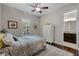 Bedroom features decor, ceiling fan and a view of an adjacent bathroom at 11755 Waterstone Loop Dr, Windermere, FL 34786