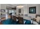 Open dining room with a large table, modern decor, and views into the kitchen and living spaces at 11755 Waterstone Loop Dr, Windermere, FL 34786