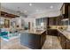 Open kitchen with a large island, stainless steel appliances, and easy access to the dining area at 11755 Waterstone Loop Dr, Windermere, FL 34786