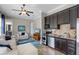 Convenient kitchenette with modern appliances and dark cabinets is perfect for guests or extended Gathering at 11755 Waterstone Loop Dr, Windermere, FL 34786