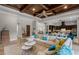 Expansive living area with open layout, leading to the kitchen, with modern furnishings at 11755 Waterstone Loop Dr, Windermere, FL 34786
