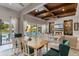 Bright and airy living and dining area with a seamless flow to the outdoor space and cozy furnishings at 11755 Waterstone Loop Dr, Windermere, FL 34786