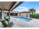Outdoor pool area with comfortable seating and a covered patio, perfect for relaxation at 11755 Waterstone Loop Dr, Windermere, FL 34786