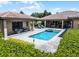 Aerial view of a backyard pool with a spa, surrounded by manicured landscaping at 11755 Waterstone Loop Dr, Windermere, FL 34786