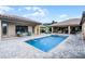 Backyard pool featuring a spa, beautiful stone patio, and comfortable outdoor seating at 11755 Waterstone Loop Dr, Windermere, FL 34786