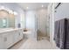 Modern bathroom featuring dual sinks, soaking tub and tiled glass enclosed shower at 1212 Civitas Way, Winter Garden, FL 34787