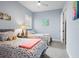 Serene bedroom featuring two twin beds, soft lighting and inviting décor at 1212 Civitas Way, Winter Garden, FL 34787