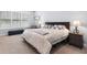 Serene bedroom with soft lighting, plush carpeting, and a well-dressed bed at 1212 Civitas Way, Winter Garden, FL 34787