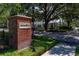 Welcoming Oakland Park entrance featuring lush landscaping, mature trees, and charming homes at 1212 Civitas Way, Winter Garden, FL 34787