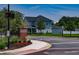 Oakland Park entry showcasing a two-story home with a landscaped lawn and colorful flowers at 1212 Civitas Way, Winter Garden, FL 34787