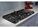 Modern kitchen cooktop with stainless steel finish and granite countertops, perfect for any cooking enthusiast at 1212 Civitas Way, Winter Garden, FL 34787
