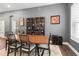 Dining room featuring a large wooden table, seating for six, and elegant decor at 1212 Civitas Way, Winter Garden, FL 34787