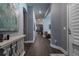 Elegant entryway featuring dark wood floors, neutral walls, and sophisticated decor at 1212 Civitas Way, Winter Garden, FL 34787