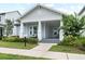 Charming single-story home featuring a welcoming front porch with elegant columns and well-maintained landscaping at 1212 Civitas Way, Winter Garden, FL 34787
