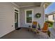 Comfortable front porch with seating and a decorative wreath, creating a warm and inviting entrance at 1212 Civitas Way, Winter Garden, FL 34787