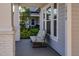 Inviting front porch with a comfortable chair, offering a relaxing outdoor space at 1212 Civitas Way, Winter Garden, FL 34787