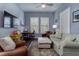 Comfortable living room offers hardwood floors and comfortable seating and is perfect for relaxation at 1212 Civitas Way, Winter Garden, FL 34787