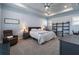 Spacious main bedroom with plush carpeting, ceiling fan, and tray ceiling, offering comfort and style at 1212 Civitas Way, Winter Garden, FL 34787