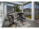 Outdoor screened porch with comfortable seating, a grill, and a view of the backyard at 1212 Civitas Way, Winter Garden, FL 34787