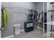 Well-organized walk-in closet with shelving, hanging rods, and gray carpet at 1212 Civitas Way, Winter Garden, FL 34787