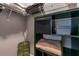 Walk-in closet with shelves, storage containers, and a unique green storage unit at 1212 Civitas Way, Winter Garden, FL 34787