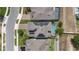 Aerial view of a neighborhood with a home equipped with solar panels and a screened-in pool at 1272 Patterson Ter, Lake Mary, FL 32746