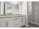 Bathroom features double vanity with granite counters, framed mirror, and walk-in shower at 1272 Patterson Ter, Lake Mary, FL 32746