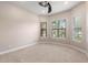 Cozy bedroom with neutral tones, soft carpeting, and ample natural light streaming through the windows at 1272 Patterson Ter, Lake Mary, FL 32746