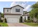 Charming two-story home featuring a brick driveway, two-car garage, and well-manicured landscaping at 1272 Patterson Ter, Lake Mary, FL 32746