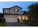 Charming two-story home featuring a brick driveway, two-car garage, and inviting curb appeal at 1272 Patterson Ter, Lake Mary, FL 32746