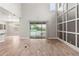 Open living room features high ceilings and sliding glass doors with view of the pool at 1272 Patterson Ter, Lake Mary, FL 32746