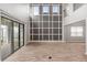 Bright living room features a decorative wall and sliding glass doors to the patio at 1272 Patterson Ter, Lake Mary, FL 32746