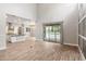 Open living room features high ceilings and sliding glass doors with view of the pool at 1272 Patterson Ter, Lake Mary, FL 32746