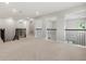 Spacious loft area featuring neutral carpet, fresh paint, and wrought iron railing overlooking other areas of the home at 1272 Patterson Ter, Lake Mary, FL 32746
