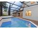 The screened-in pool is a shimmering retreat, enhanced by ambient blue lighting in the evening at 1272 Patterson Ter, Lake Mary, FL 32746