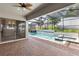 Inviting screened-in pool area with a relaxing spa and lush greenery, perfect for outdoor enjoyment at 1272 Patterson Ter, Lake Mary, FL 32746
