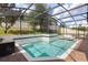 A screened-in pool and hot tub with brick pavers and well-maintained landscaping offer a tranquil escape at 1272 Patterson Ter, Lake Mary, FL 32746