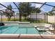 Sparkling pool and spa surrounded by a screen enclosure, offering a private backyard oasis with lush landscaping at 1272 Patterson Ter, Lake Mary, FL 32746