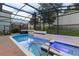 An inviting screened-in pool and hot tub with ambient blue lighting makes for relaxing evenings at 1272 Patterson Ter, Lake Mary, FL 32746