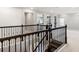 Upstairs landing features a dark wood and wrought iron staircase at 1272 Patterson Ter, Lake Mary, FL 32746