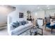 Bright living room with an open floor plan, neutral decor, and lots of natural light at 1302 Isleta Loop, Kissimmee, FL 34741