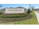 Osceola Village Center community sign surrounded by lush landscaping at 1302 Isleta Loop, Kissimmee, FL 34741