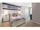 Nautical themed bedroom with white furniture, blue accents, and carpet flooring at 1304 Isleta Loop, Kissimmee, FL 34741