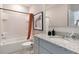 Bathroom featuring a shower and tub combination along with a granite vanity at 1310 Isleta Loop, Kissimmee, FL 34741