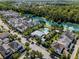 Beautiful aerial view of homes near a lake and community pool at 1356 Coralstone Dr, Celebration, FL 34747