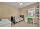 Nicely decorated bedroom with twin bed, desk, and window, perfect for a or teen at 1356 Coralstone Dr, Celebration, FL 34747