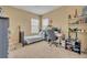 Bedroom featuring a study desk, a twin bed, and a window for natural light at 1356 Coralstone Dr, Celebration, FL 34747