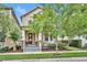 Charming two-story home featuring a covered front porch with classic columns and a well-manicured front yard at 1356 Coralstone Dr, Celebration, FL 34747