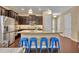 Bright kitchen with large island, stainless steel appliances and breakfast bar at 1356 Coralstone Dr, Celebration, FL 34747