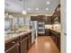 Modern kitchen boasts stainless steel appliances, dark cabinetry and granite countertops at 1356 Coralstone Dr, Celebration, FL 34747